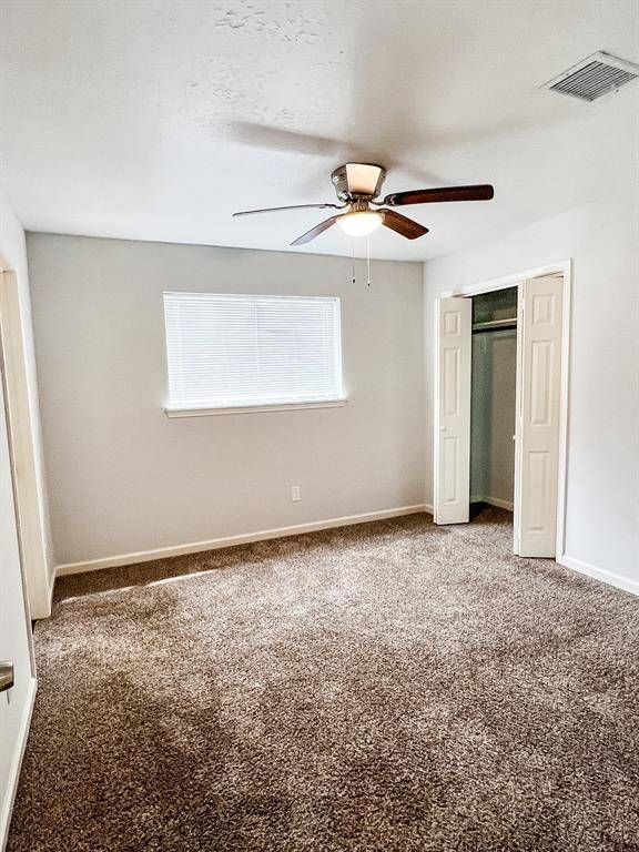 View of the secondary bedroom with direct access to the full bathroom.