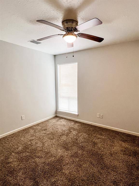 View of the third bedroom with also access to the full bathroom.