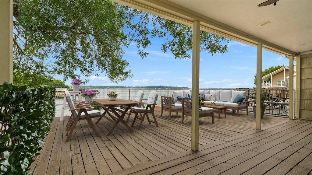 Spectacular view of Lake Conroe is enjoyed from the balcony with half covered and other half to enjoy the stars in the evenings. Whether this is full or part time living, this is the perfect place for lake living memories. VIRTUALLY STAGED