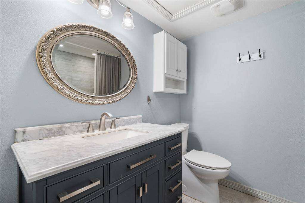 Hall full bath with tub and shower.