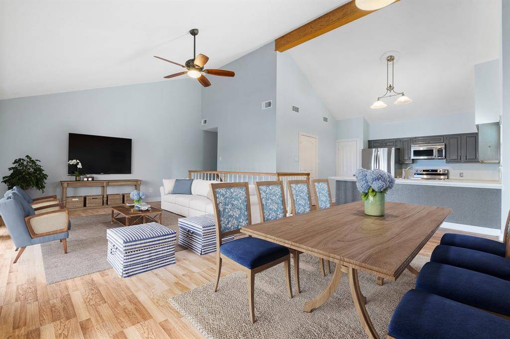 Looking from the dining area you can see the pretty blond flooring and the recessed kitchen. VIRTUALLY STAGED