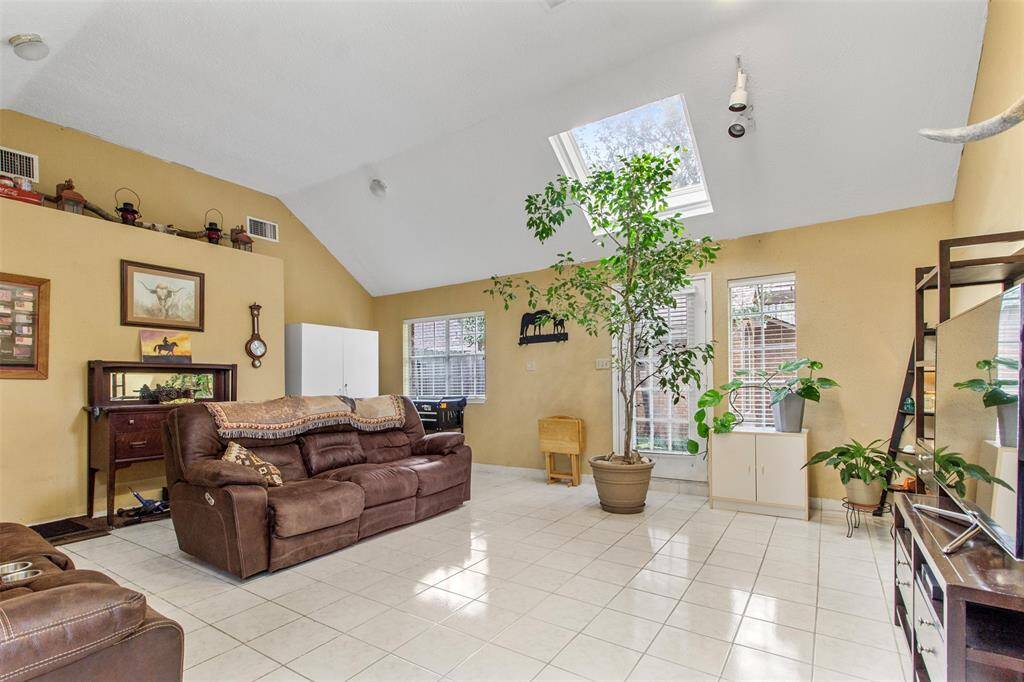 Another view of the bright andspacious living room.