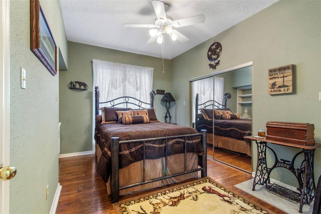 Secondary bedroom also has sliding closet doors with mirrors.