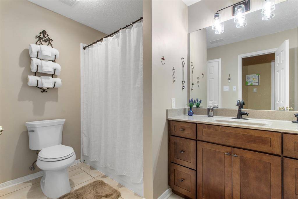 Secondary bathroom features atub/shower combo and vanitywith plenty of counter space.