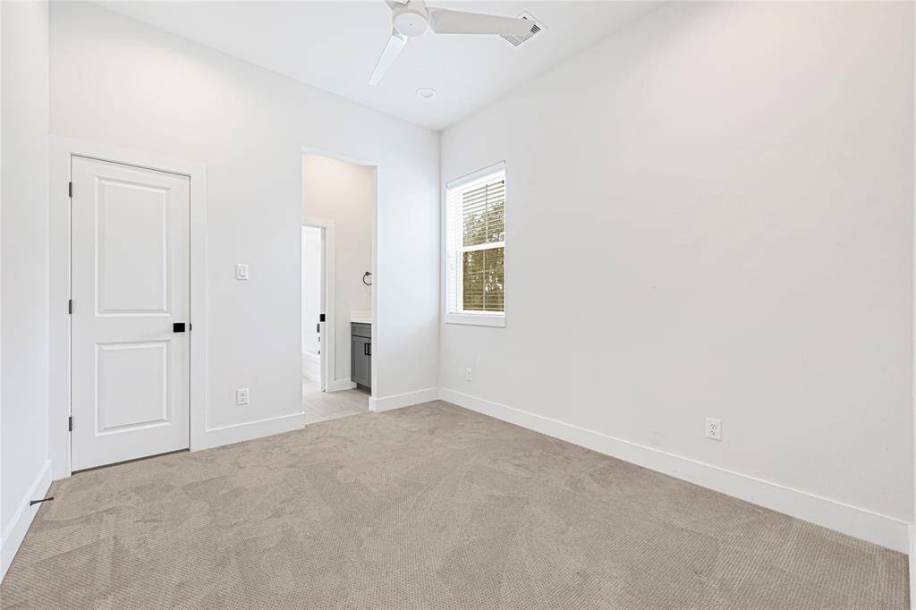 Comfortable third bedroom, perfect for a nursery, guest room, or flex space.
