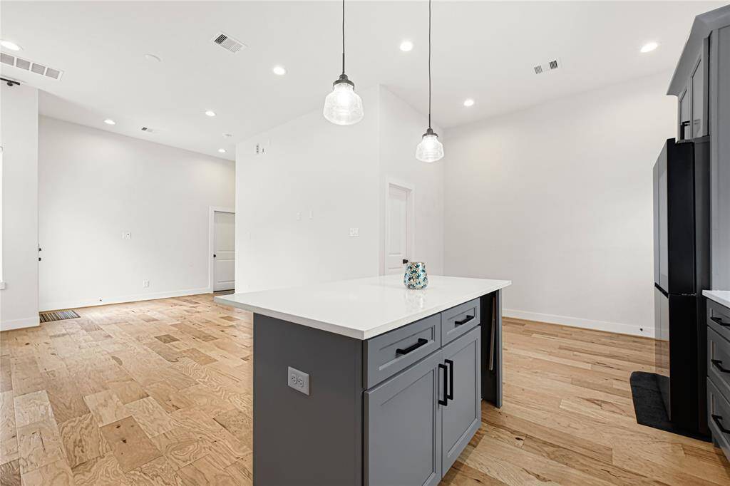 Open-concept dining area seamlessly connected to the kitchen and living room.