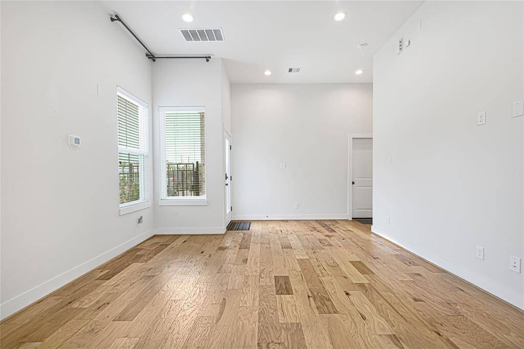 Bright and airy living space featuring high ceilings and abundant natural light.