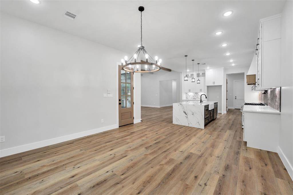 This design allows for easy entertaining and maximizes the use of space, ensuring that every corner of the home is both functional and inviting