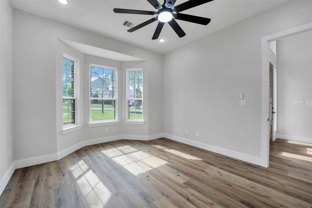 The secondary primary bedroom offers a similar level of luxury and comfort