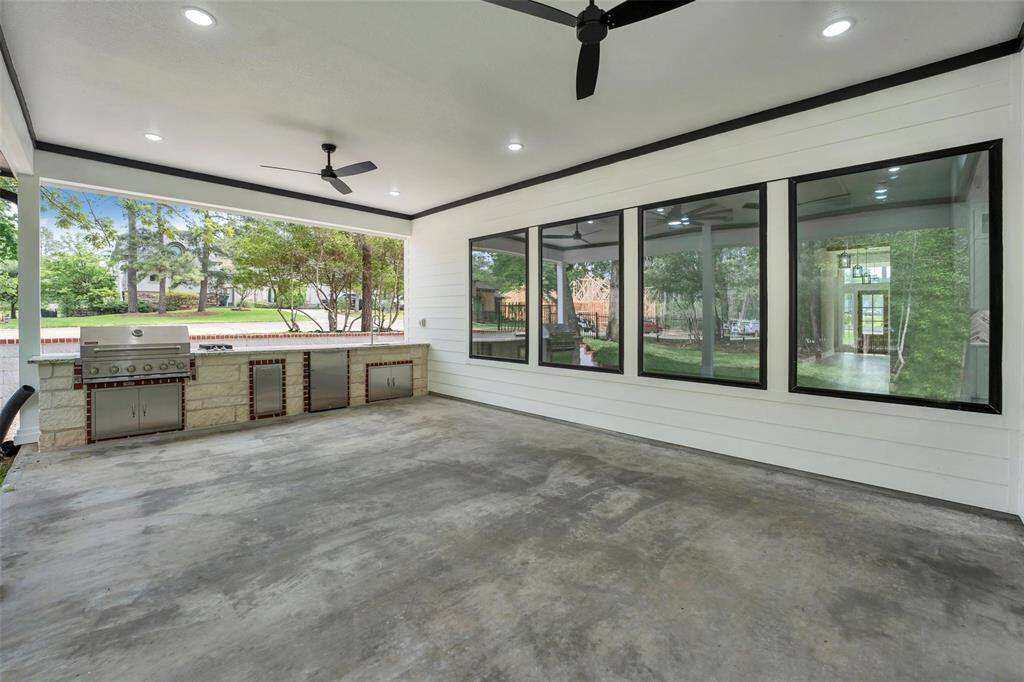 This ultimate outdoor cooking area is well-equipped w/ grill and stove burners with ample counter space