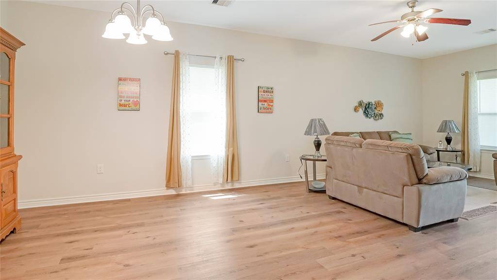 Overlooking the living room is a spacious dining room where the family can sit, eat and make memories together.