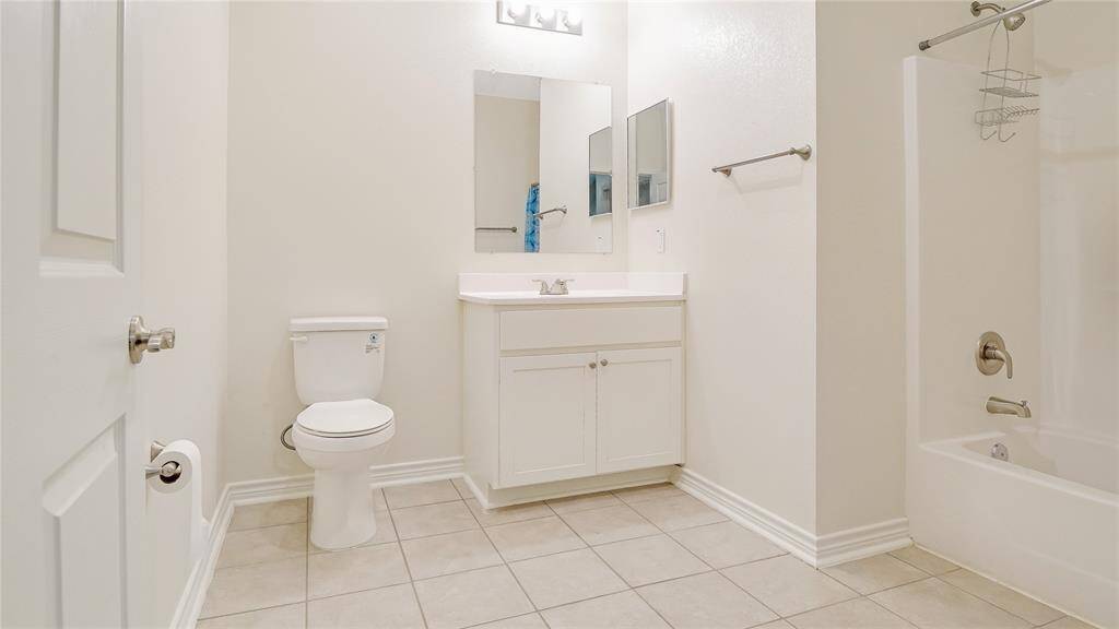 The secondary bathroom is large and open and consists of a shower/tub combintation.