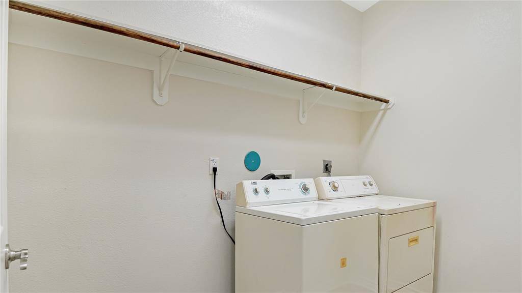 The laundry room is set up for a full size washer and a full size dryer.
