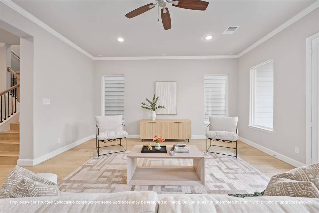With Sherwin-Williams paint and soft natural light, the living room offers a serene and flexible space for relaxing or entertaining.