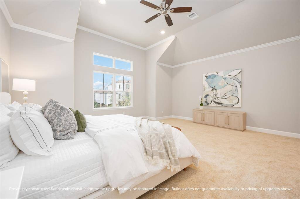 Oversized windows bring in sunshine and treetop views, balancing luxury with calm in this restful retreat.