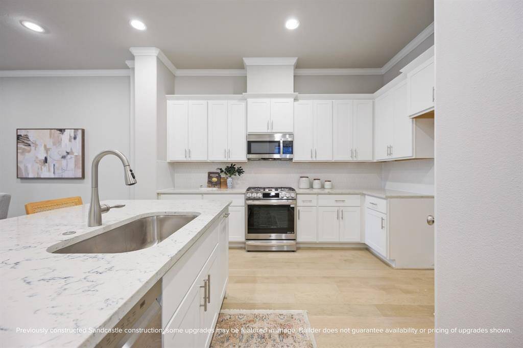 The heart of the home delivers with LG appliances, custom cabinetry, and soft-close drawers—designed for everyday life with elevated style. Finishes in the completed home may differ.