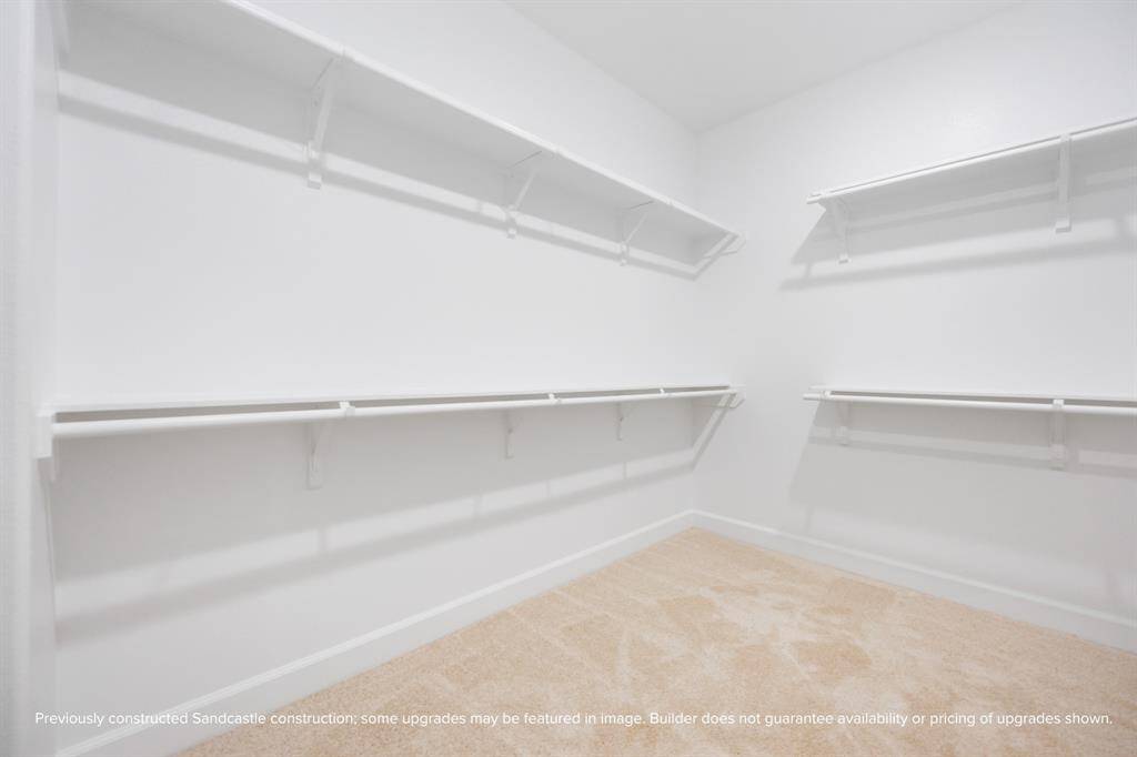 With built-in shelves and tons of hanging space, the second walk-in closet brings smart storage and everyday elegance together.