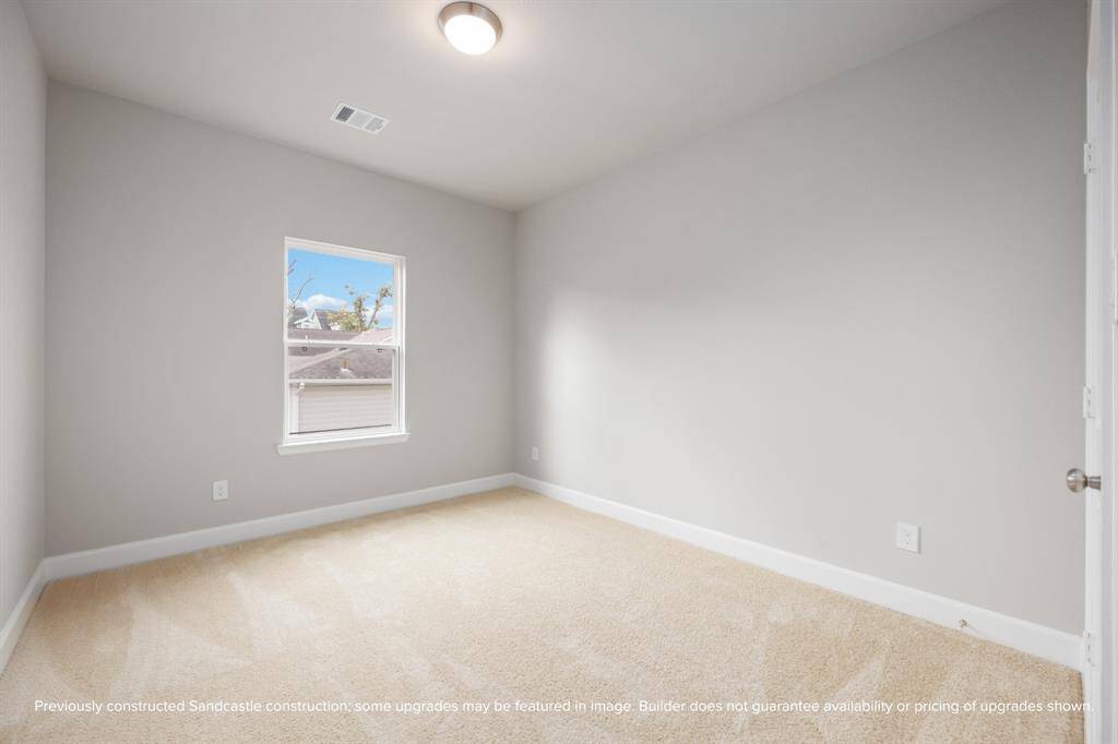 Plush carpet, natural light, and versatile dimensions make the guest bedroom feel cozy and welcoming for visitors or flexible use.