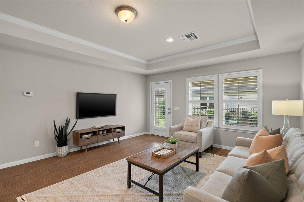 The tray ceiling enhances the light and airy feel of the room, elevating the height to an impressive 10 feet.
