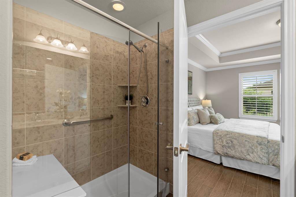 Shower with grab bars and bench.