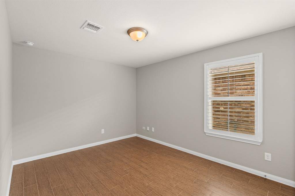 Guest bedroom - there is no carpet downstairs.