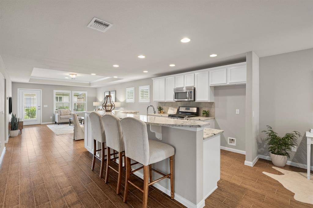 Level 4 cabinetry, tray ceilings with crown molding, and the highest level of granite countertops make this home truly stand out from the rest.