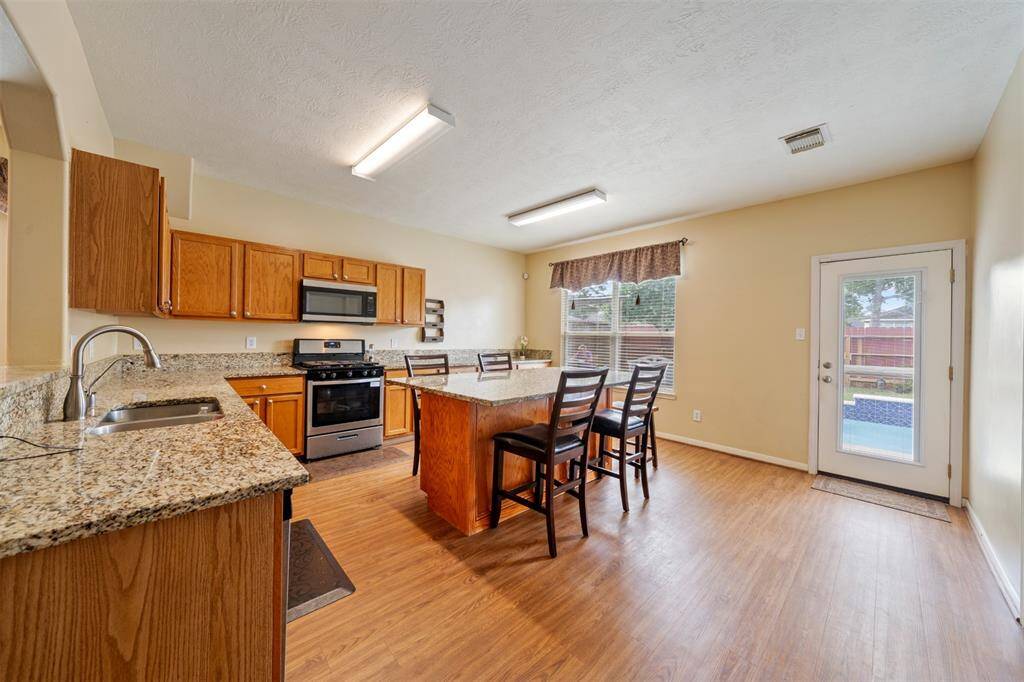 Extended cabinetry in kitchen for more prep space.