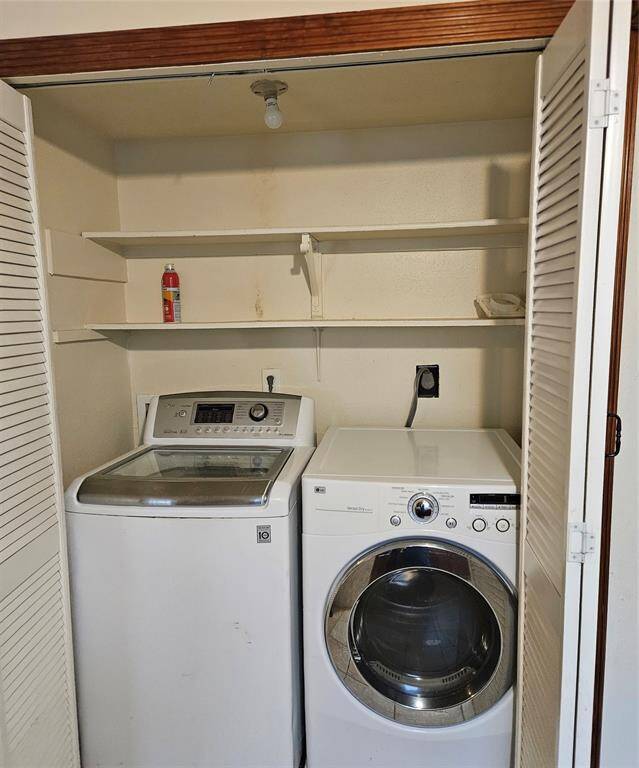 Laundry nook which includes a LG washer and Dryer which stay with the townhome.