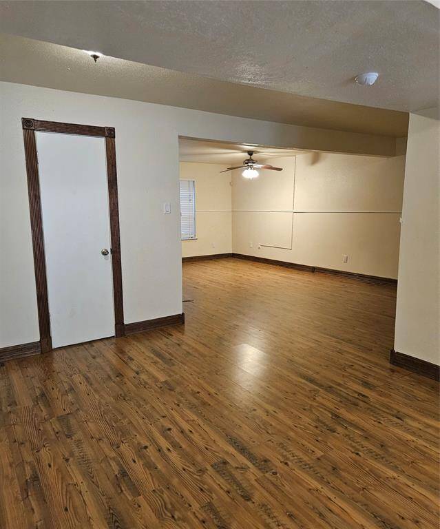 A view of the living room looking from the dinette area.  There is a half bath behind the door. Such a convenience for guest!