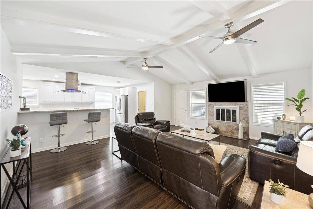 From the family room, enjoy an open view into the renovated kitchen—creating an easy flow for everyday living and entertaining. A peninsula with bar seating offers the perfect spot for casual meals, morning coffee, or keeping the cook company.