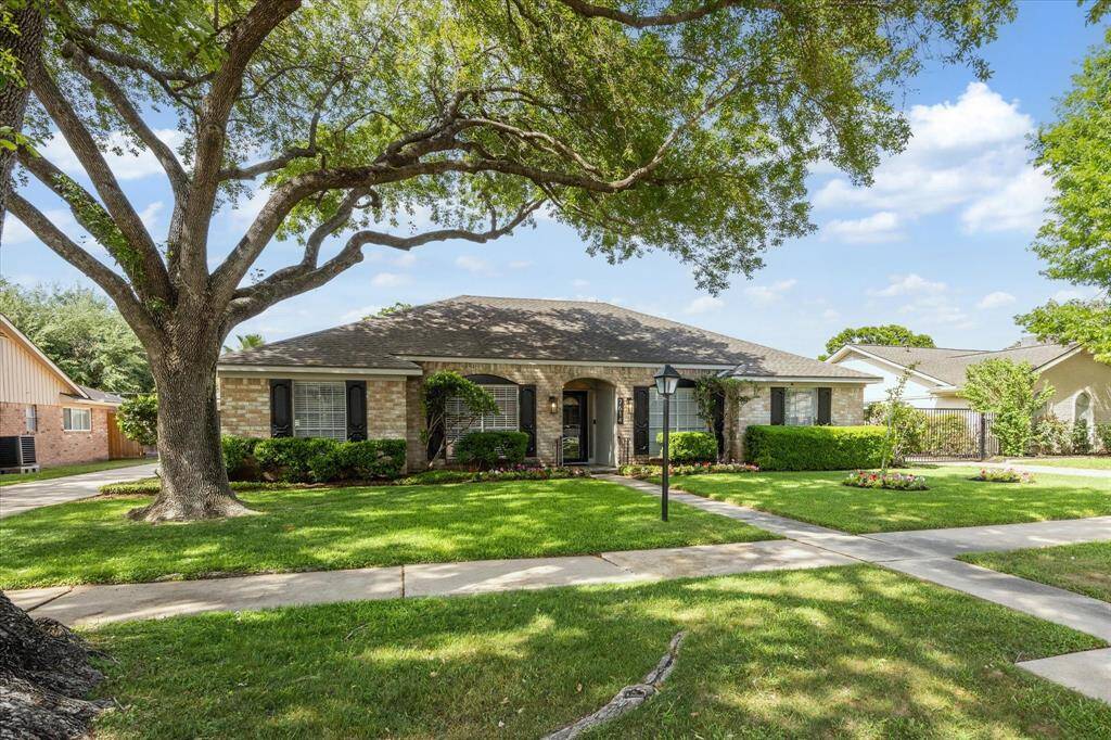 Outside you will find beautiful, established oak trees, fruit trees, and manicured landscaping.