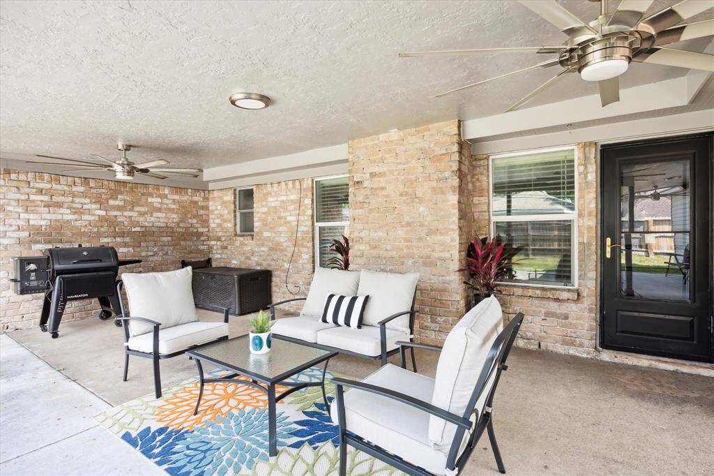 With multiple seating areas, this generous patio is ready for gatherings large or small—and already prepped with electrical and plumbing for a future outdoor kitchen.