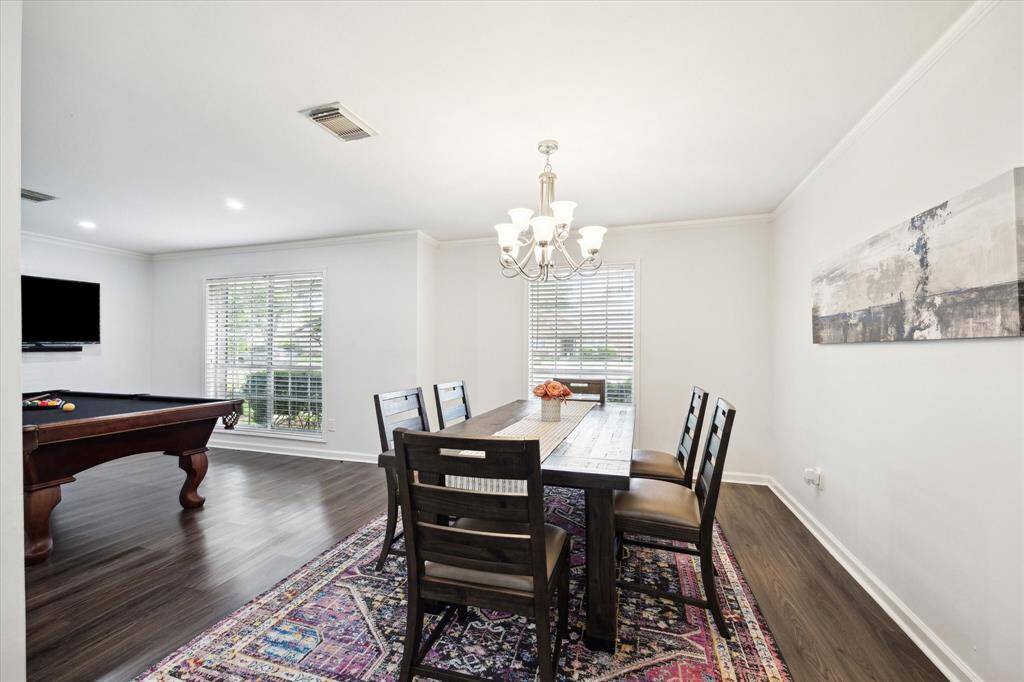 With the dining room positioned between the kitchen and living room, the layout offers an effortless flow—ideal for entertaining. Open sightlines throughout create a connected, inviting feel that's perfect for gatherings of any size.
