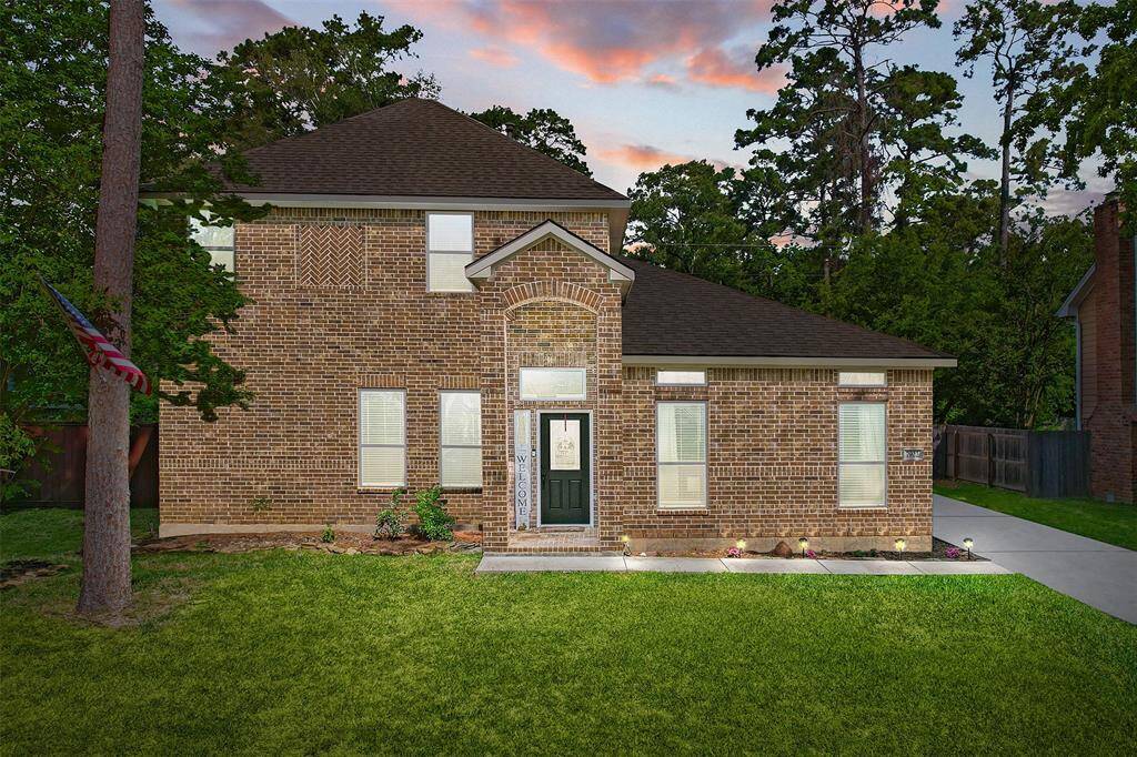 Welcome to this beautifully maintained two-story brick home, nestled among mature trees with a lush front lawn that sets the tone for comfort and charm. From the moment you arrive, you’ll feel the inviting warmth and timeless appeal that make this home truly special.