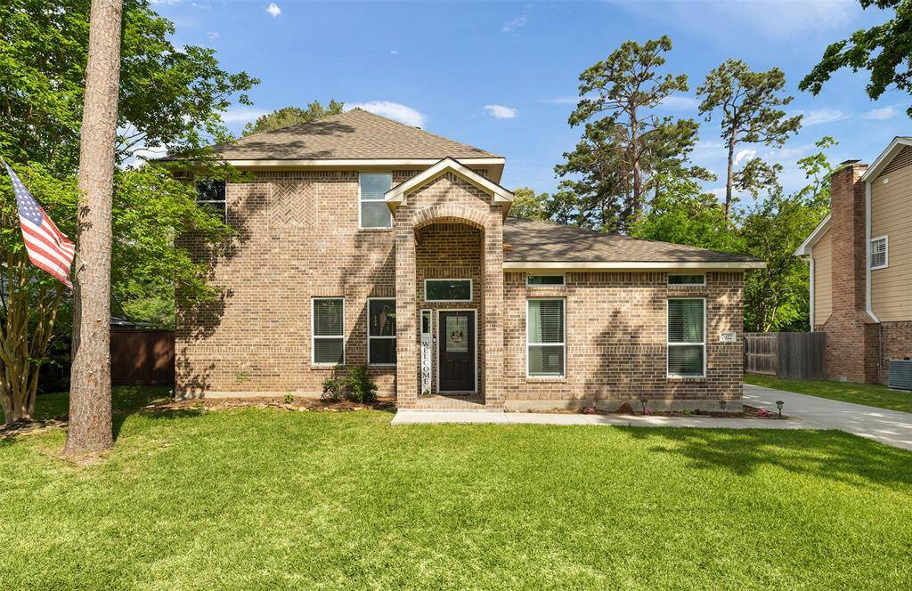 This inviting two-story brick home features a covered front porch and spacious driveway, all framed by a manicured lawn and mature shade trees. Set in a quiet neighborhood, it’s the perfect place to enjoy peaceful mornings and warm welcomes home.