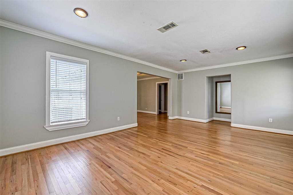 Looking from the living room to the primary bedroom.