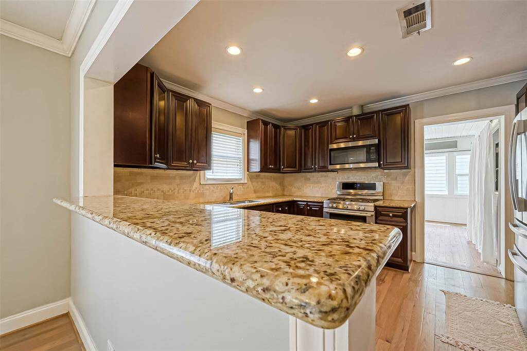 Looking through the kitchen to the sunroom.
