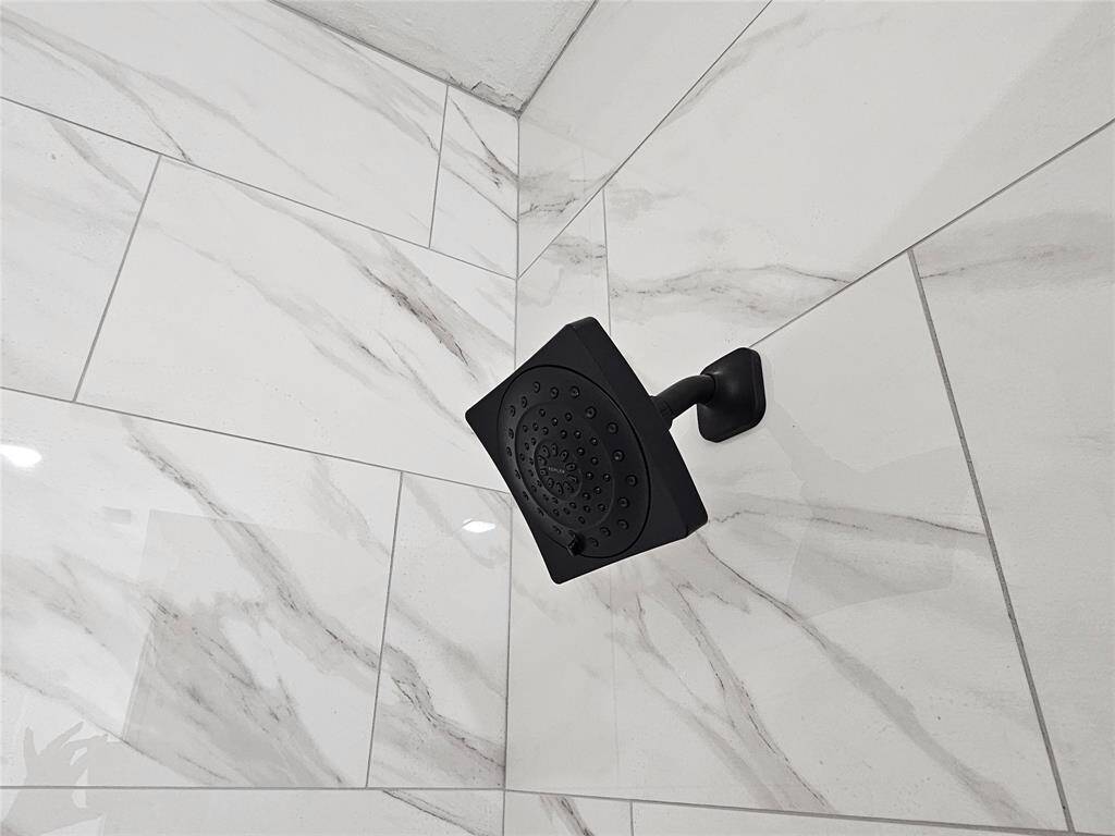 Black high effiency shower head.