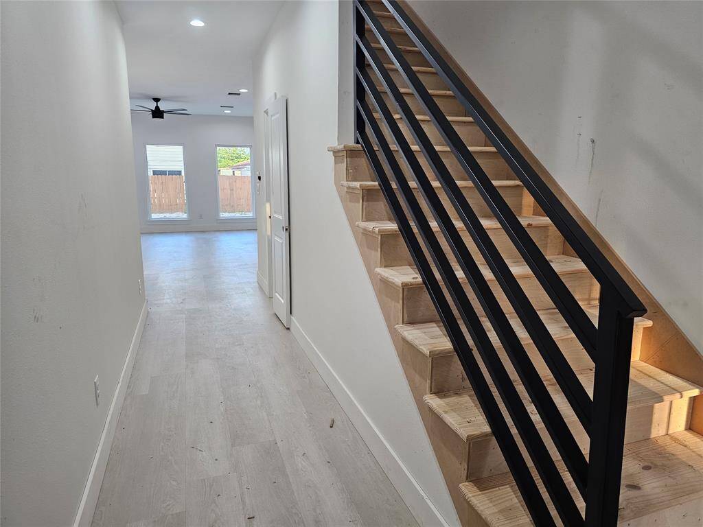Hallway to kitchen, breakfast area, and spacious family room.