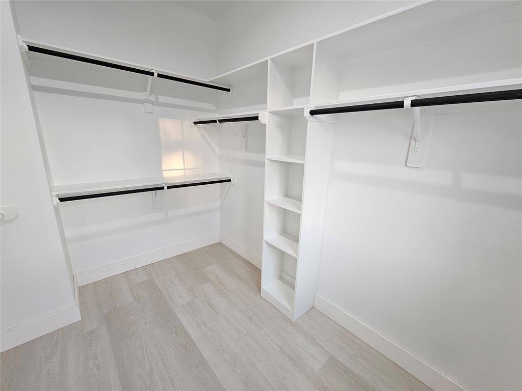 One of 2 custom closets in primary suite.