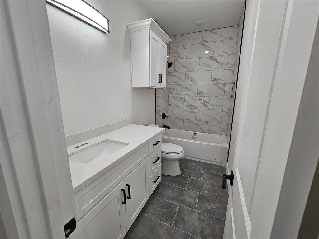 secondary bathroom with double sinks.