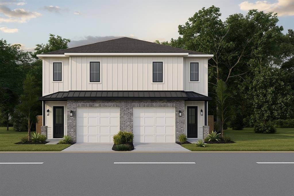 Modern spec of home, with black steel canopy.
