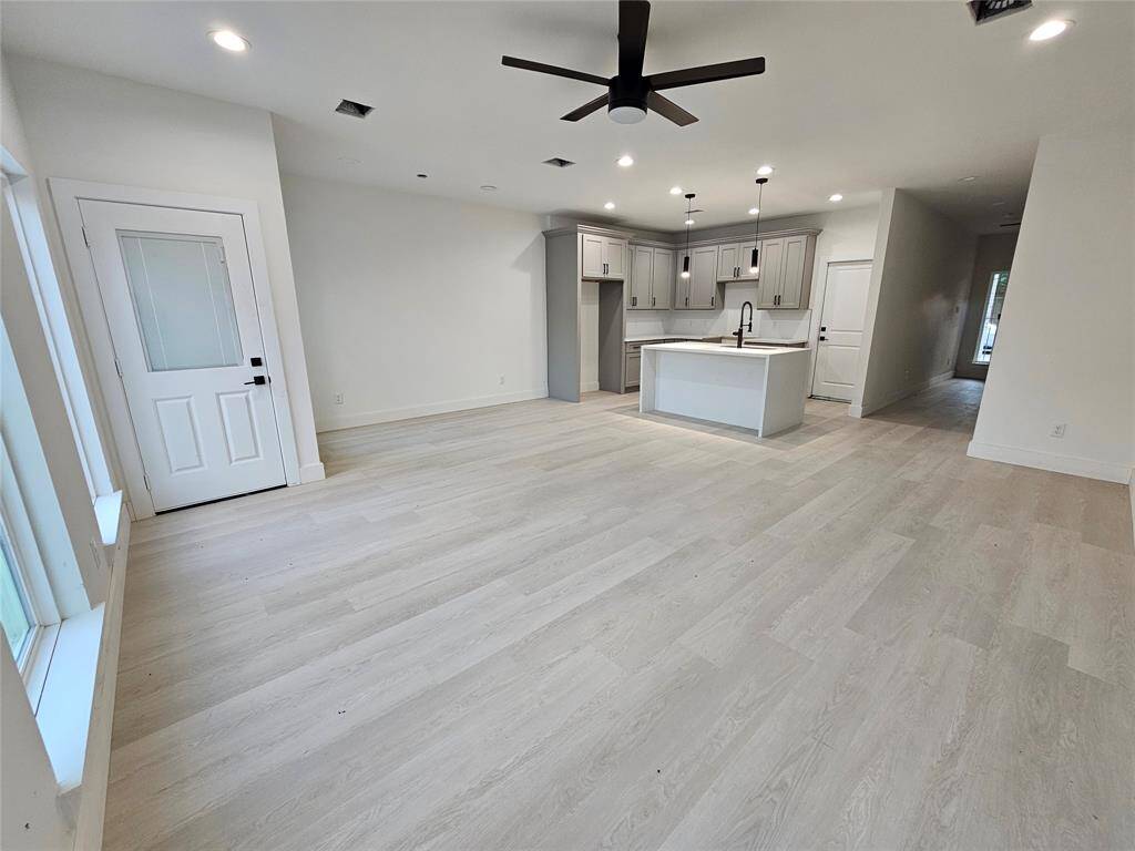 SPacious living area with picture windows.