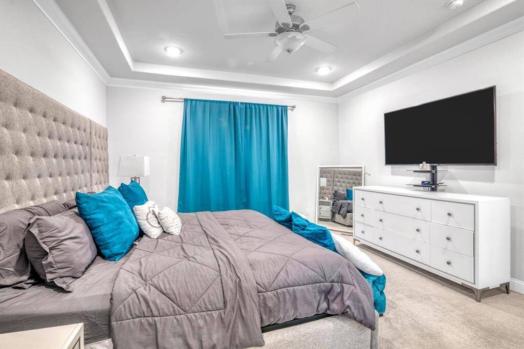 Primary bedroom has views overlooking the water.