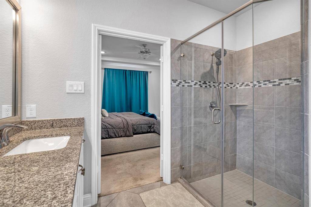 Granite tops, with massive walk in shower!