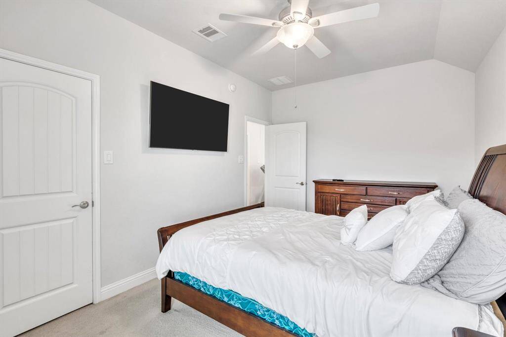 3rd bedroom with carpet.