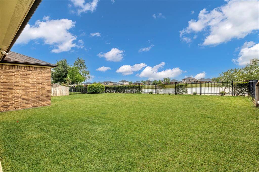 Large back yard on a premium lot over looking the water.