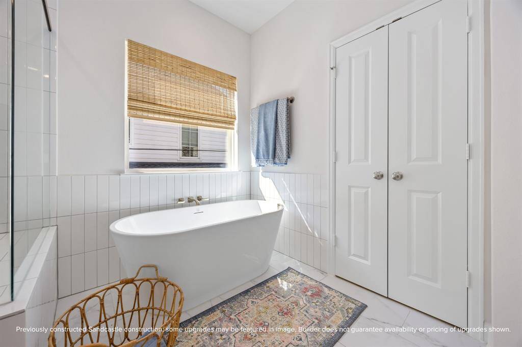 Bask in the natural light and calming tones of this serene bathroom retreat—perfect for long soaks and quiet moments of relaxation.
