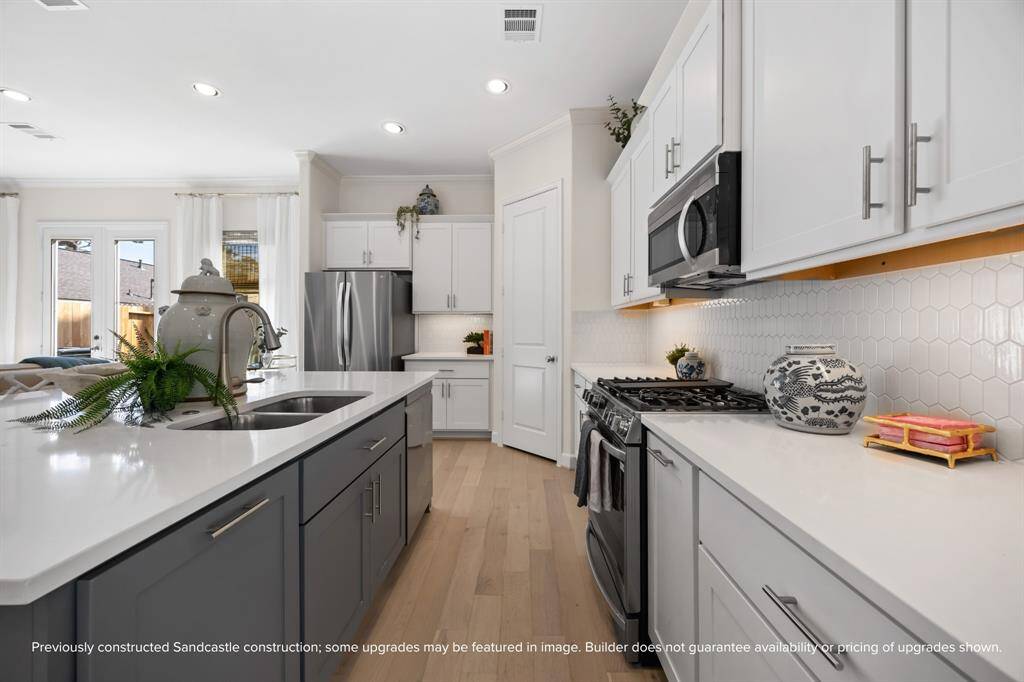 Spacious, seamless, and oh-so-stylish. With generous storage, a walk-in pantry, and effortless flow, this kitchen is ready for whatever the day brings. Final selections were made by LYRD Interiors and may vary.