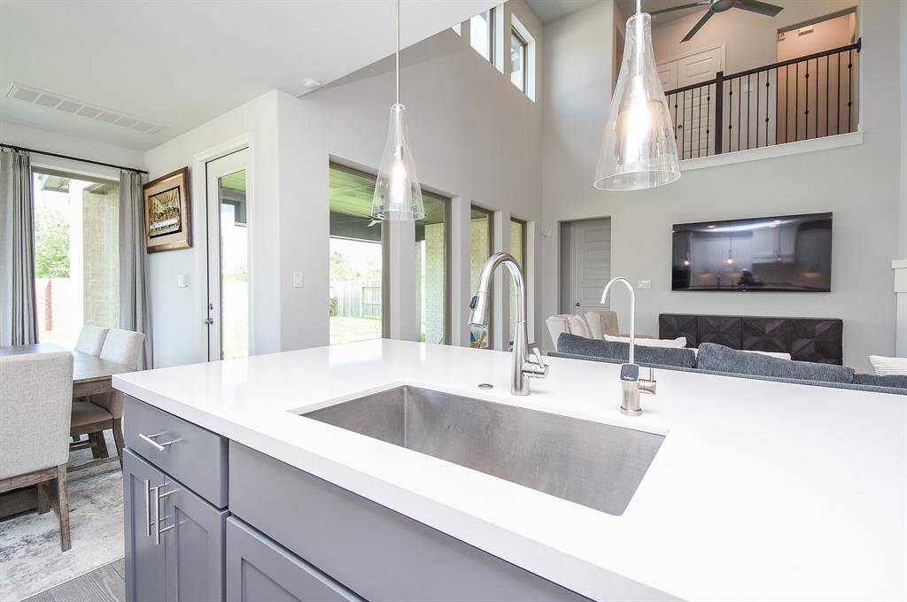 Keep an eye on the kids or the Sunday game with the double wide craft sink facing the family room.